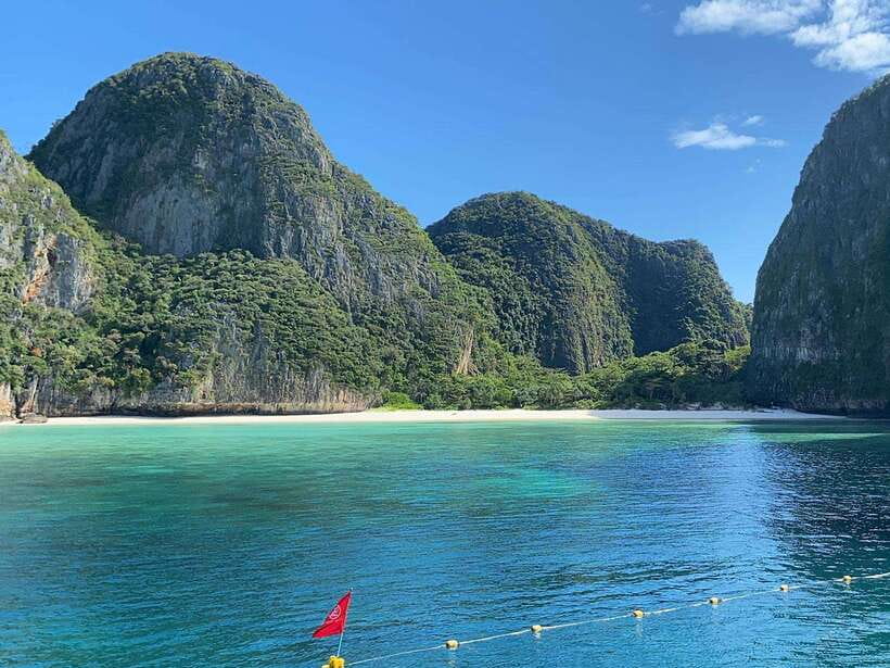 Koh Phi Phi: Maya Bay Private Longtail Boat Tour - Early Maya Bay: iconic photos, possible sharks, and the closure reality